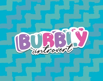 May include: A sticker featuring the text "BUBBLY introvert". The word "BUBBLY" is in purple, blue, and pink, with white outlines. The word "introvert" is in a smaller, cursive font. The background is a teal and blue zigzag pattern.