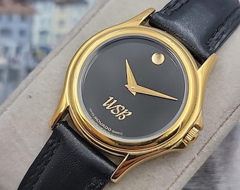 Reloj Movado Museum para mujer: bisel dorado, correa de piel negra