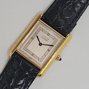 Cartier unisexe Must de Tank cadran gris, bracelet original, épuré et chic