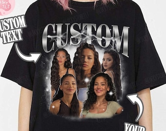 May include: A black short-sleeved t-shirt featuring a large graphic print with the word CUSTOM in a metallic font at the top. The design includes a collage of five photographs of a person with long dark hair, surrounded by a glowing white aura effect.