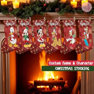 May include: Six red Christmas stockings with Disney characters, including Donald Duck, Mickey Mouse, and Pluto, hang above a fireplace. Each stocking is personalized with the name "Amelia" and features a festive snowflake pattern.