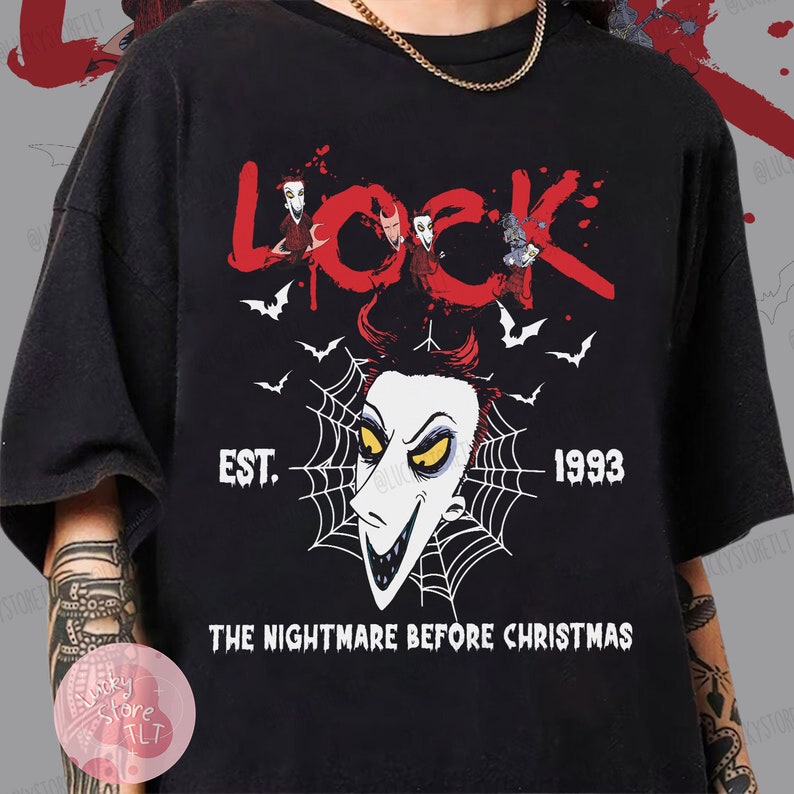 May include: Black t-shirt featuring the word "Lock" in red with cartoon characters and bats. Below is a white face with a spiderweb design, the text "EST. 1993" and "THE NIGHTMARE BEFORE CHRISTMAS".