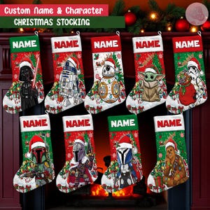 May include: A collection of Christmas stockings featuring Star Wars characters like Darth Vader, R2-D2, and Baby Yoda. Each stocking has a red top with the word "NAME" and a green cuff. The stockings are decorated with festive holiday designs and character illustrations.