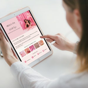 May include: A pink and white tablet screen displaying a website with the text "HELLO, I'M Madeline Reyes BUSINESS AND LIFESTYLE INFLUENCER LET'S WORK TOGETHER! This is a great paragraph to talk about who you are, where you come from and what's your mission and passion in social media. Also a great place to talk more about your platforms and what kind of content do you like to create. BRANDS I'VE WORKED WITH" and a grid of images.