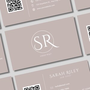 May include: A beige business card with a white circle containing the letters "SR" and the text "SARAH RILEY" below. The card also includes a QR code, contact information, and the text "hello@email.com" and "156-7890".