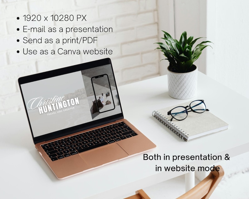 May include: A laptop computer with a rose gold exterior is open to a presentation slide. The slide features a white logo with the text "Christine HUNTINGTON TRAVEL BLOG CREATOR". The laptop is on a white desk with a notebook, glasses, and a potted plant.