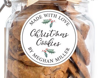 May include: A glass jar filled with Christmas cookies, with a white round label that says "Made with Love Christmas Cookies by Meghan Miller".