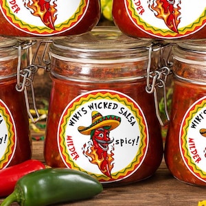 May include: Five glass jars with metal clamp lids filled with red salsa. Each jar features a circular label with the text Wiki's Wicked Salsa, Milder, and Spicy!, depicting a cartoon chili pepper wearing a sombrero and surrounded by flames.