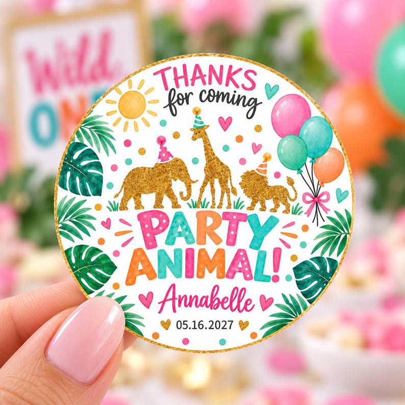 May include: A round sticker featuring a gold glitter elephant, giraffe, and lion wearing party hats. The text reads "THANKS for coming", "PARTY ANIMAL!", "Annabelle", and "05.16.2027". The design includes a yellow sun, colorful balloons, and green leaves.