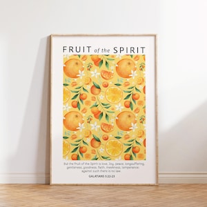 May include: A printable wall art print with a yellow background and a pattern of oranges and white flowers. The text "FRUIT of the SPIRIT" is at the top of the print. The text "But the fruit of the Spirit is love, Joy, peace, longsuffering. gentleness, goodness, faith, meekness, temperance: against such there is no law. GALATIANS 5:22-23" is at the bottom of the print.
