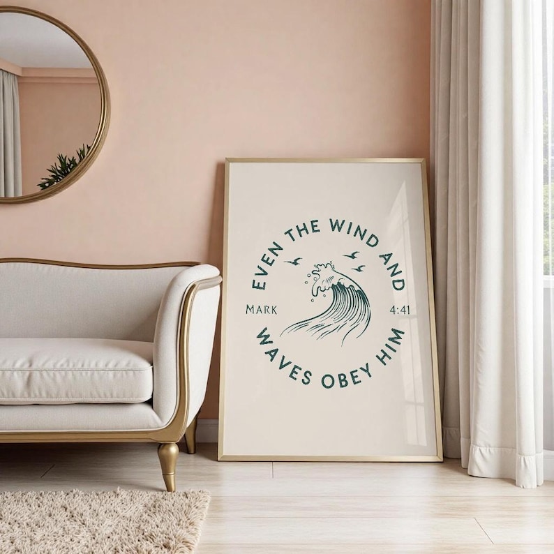 May include: A framed art print with a gold frame, featuring the text "Even the wind and waves obey him" in a circular design. The artwork includes a stylized wave illustration in teal and three birds.