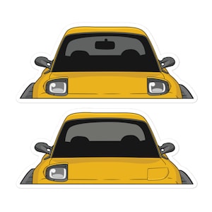 May include: Two stickers featuring a yellow sports car with black windows, side mirrors, and headlights. The car's design is a stylized illustration, perfect for car enthusiasts or those looking for unique decals.