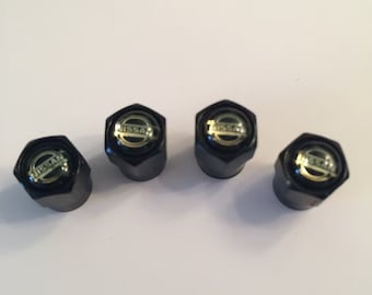 Shiny Black Nissan Dust Valve Caps - (Set of 4)