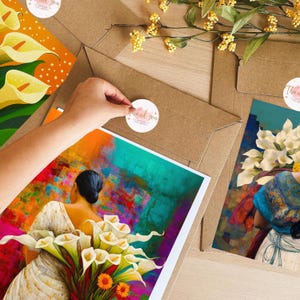May include: A colorful abstract painting featuring a woman holding a bouquet of white calla lilies. The painting has a vibrant blue, green, orange, and yellow color scheme. The woman is wearing a white dress and has dark hair. The painting is framed and ready to hang.