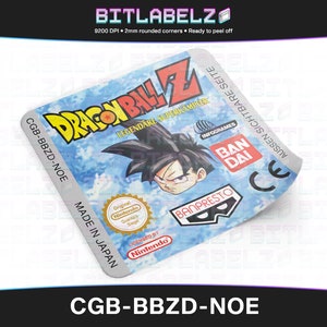 May include: A close-up of a Dragon Ball Z video game cartridge label. The label is white with black text and a blue background. The text on the label reads "Dragon Ball Z", "Legendäre Superkämpfer", "InfoGrames", "BanDai", "Banpresto", "CGB-BBZD-NOE", "Made in Japan", "Original Nintendo Quality Siegel", "Licensed by Nintendo", and "Aussen Sichtbare Seite".