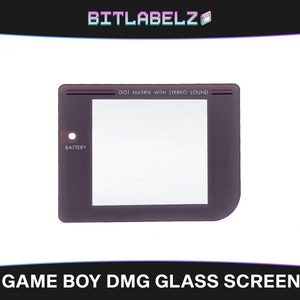 May include: A replacement glass screen for a Game Boy DMG handheld console. The screen is clear and has a black border with the text "DOT MATRIX WITH STEREO SOUND" printed on the top.