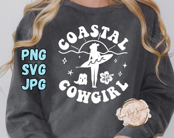 May include: Dark gray sweatshirt with the words "COASTAL COWGIRL" in white, along with a graphic of a cowgirl with a surfboard, stars, and a hibiscus flower. The left side of the sweatshirt has the text "PNG SVG JPG" in light blue.