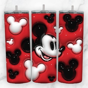 May include: Three red tumblers with a white and black Mickey Mouse design. The tumblers have a clear lid and a straw.
