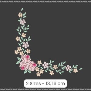 May include: A corner embroidery design featuring pink and white flowers with green leaves. The design is available in two sizes: 13 and 16 cm.