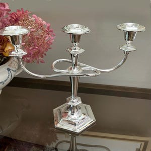 Vintage candle holder from England. 3 candles, 2 arms candelabra
