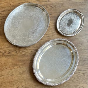 Antique silver plated oval serving trays from England. Priced individually