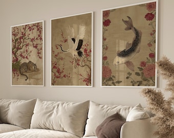 May include: Three framed art prints with Asian-inspired illustrations. One shows a tiger, another a crane, and the third a koi carp, all on a sepia background with floral accents. The prints are displayed above a beige sofa.