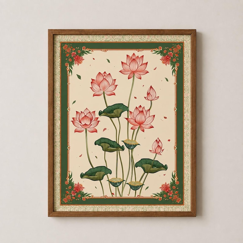 May include: A framed wall art print featuring a botanical illustration of pink lotus flowers and green lily pads on a cream background. The artwork is enclosed in a dark green border with red floral corner accents and a thin wooden frame.