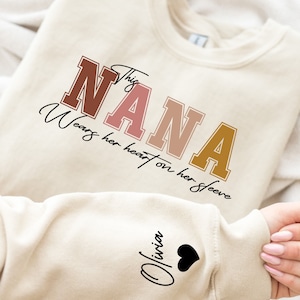 I Wear My Heart On My Sleeve Nana Sweatshirt, Custom Nana Sweatshirt With Kids Name on Sleeve, Nana Gift Hoodie, Kids Name on Sleeve Sweater