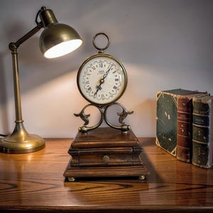 May include: A set of three ceramic mugs with a speckled, matte finish. The mugs are in shades of cream, light gray, and dark gray. Each mug has a simple, minimalist design, perfect for coffee or tea.