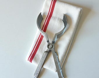 Vintage tongs for holding and slicing meat, bread,  food items. Tairost-Ape, H.K brand kitchen tongs made in Japan .