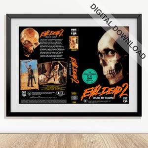 May include: A framed print of the movie "Evil Dead 2: Dead by Dawn." The artwork features a skull, images of characters, and the movie title in orange. The print is labeled "Digital Download."