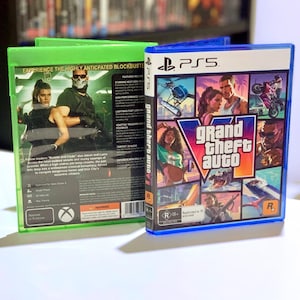 May include: A PlayStation 5 game case for Grand Theft Auto VI featuring a collage of characters and action scenes on the front, alongside an Xbox Series X game case showing two characters on the back with descriptive text.