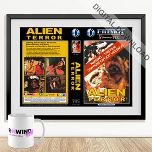 May include: A framed "Alien Terror" movie poster with a black frame. The poster displays the film's title in yellow, stills from the movie, and a warning about explicit violence. A white mug with the word "Rewind" is in the foreground.