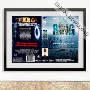 May include: A framed digital download of "The Ring" VHS movie cover. The cover features a woman's face, a blue portal, and the text "It's creepy, atmospheric and downright unnerving..." and "It scared the s**t out of me".
