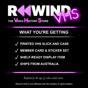 May include: A black graphic display featuring the white text REWIND VHS THE VIDEO HISTORY STORE with pink neon accents. The list includes a printed VHS slick and case, member card and sticker set, and a shelf-ready display item on a black background.