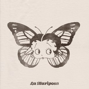 May include: A black and white illustration of a butterfly with a cartoon face. The butterfly has the text "La Mariposa" underneath it.