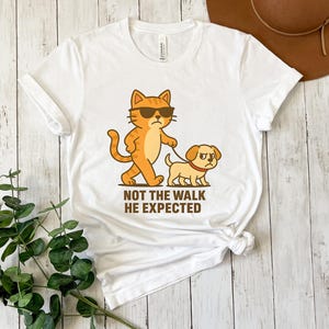 Funny Cat Walking Dog Shirt, Not the Walk He Expected Tee, Cartoon Animal Graphic Tee, Sarcastic Pet Humor Gift, Introvert Shirt