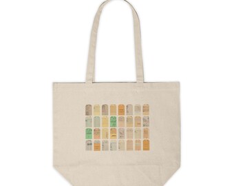 May include: A beige tote bag with a design of a grid of vintage, yellowed, and faded paper tags. The tags are in various shades of yellow, orange, and green.