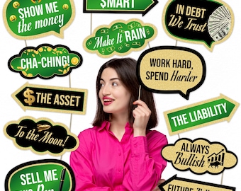 May include: A collection of green and gold photo booth props with financial themes. Phrases include "Show Me the Money," "Cha-Ching!," and "The Asset." Other props say "Smart," "Make it Rain," and "Future Billionaire."