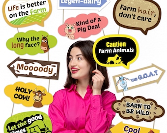 May include: A collection of farm-themed photo booth props with various speech bubble designs. The props feature phrases like "Life is better on the farm," "Holy Cow!," and "Cool chick." The props are held by a person wearing a pink shirt.