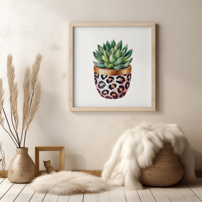 May include: Watercolor print of a succulent plant in a pink and black leopard print pot with a gold rim. The plant has green leaves. The artwork is framed in a light wood frame.