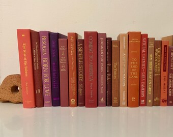 Assorted pink and brown staging books, decorative book stack, home office library decor, books by the foot, staging prop books, library core