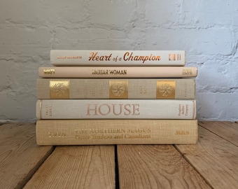 Gold tone set of decorative books, neutral book decor, luxury staging books stack, stack of vintage books by colour,  home styling books