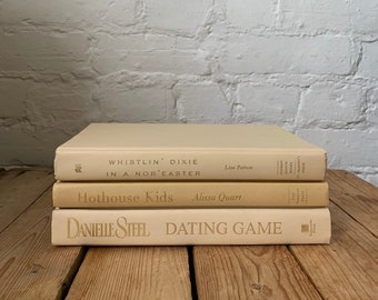 Beige book stack, staging books, aesthetic books, bookshelf decor, coffee table decor books, beige home decor, books for entryway console