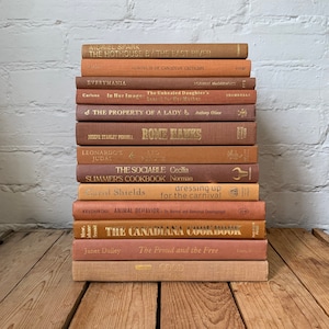 Brick book decor, rustic bookshelf decor, light brown stacked books, terracotta decorative books, prop staging styling books for decorating