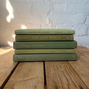 Olive green book stack, olive green book decor, decorative books, bookshelf decor, shelf staging books, boho decor, coffee table books