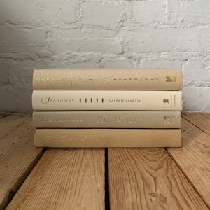 Cream and taupe book stack, ivory book decor, cream and ivory decorative book stack, cream home decor, cream staging books, boho house decor