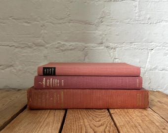 Rose staging books, soft pink bookshelf decor, blush book stack, warm pink vintage styling books for home decor, stacked staging prop books