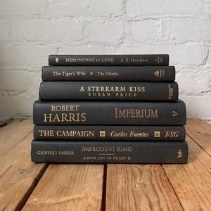Black book stack, black stacked books, black book decor, black coffee table books, black prop books, black staging books, modern home decor