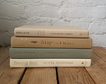 Green and tan book stack, tan and sage book decor, decorative book stack, neutral bookshelf decor, staging prop books, coffee table books